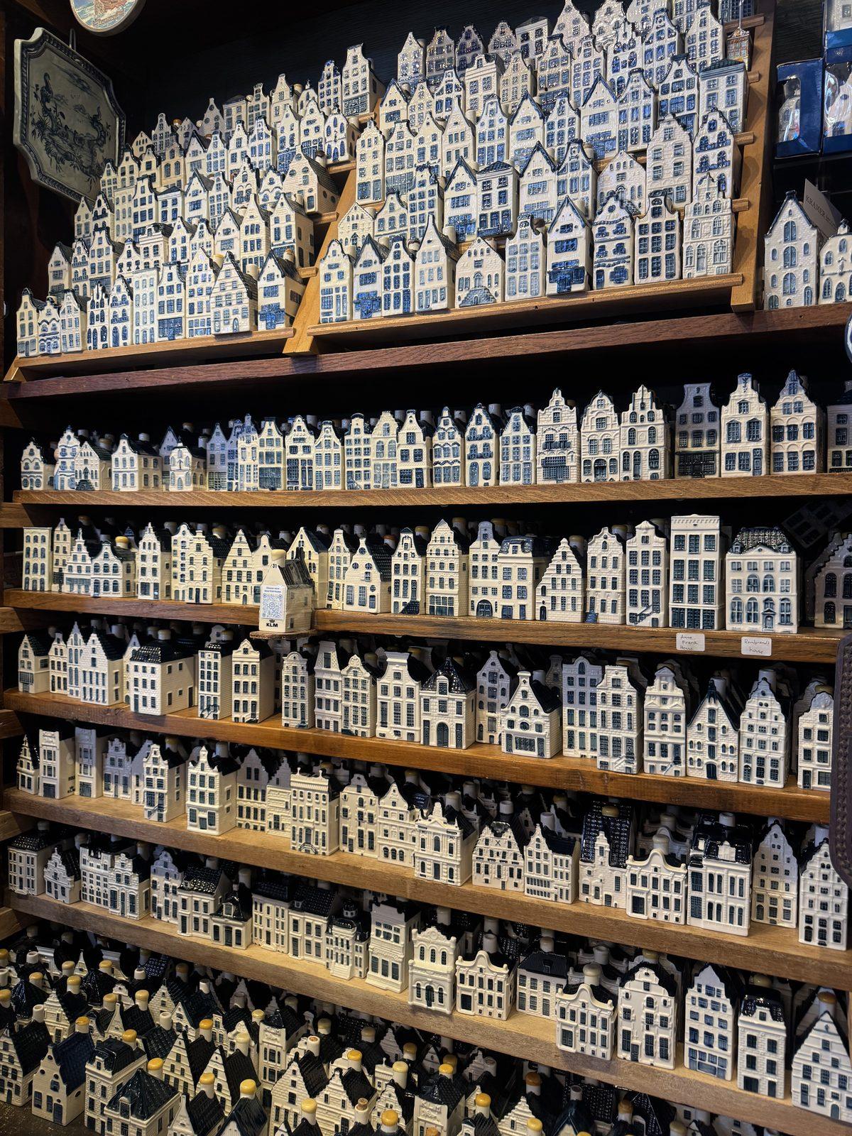 Shelves of little ceramic canal houses in a shop window
